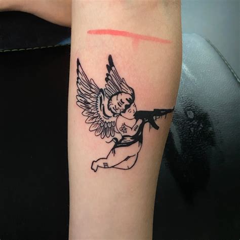 35 Beautiful Angel With Gun Tattoo Designs April 2025