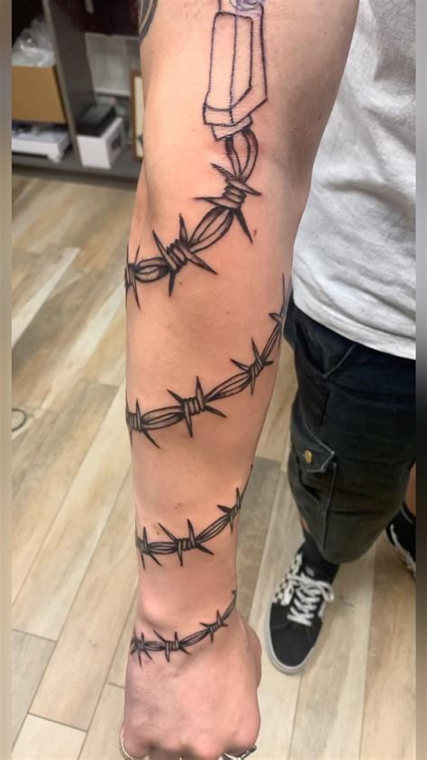Striking Barbed Wire Arm Tattoo Ideas & Meanings