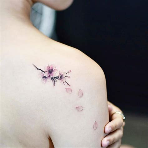 Cherry Blossom Tattoo On The Right Shoulder Blade