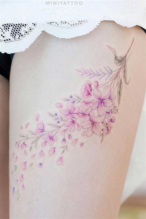 Cherry Blossom Thigh Tattoo: Delicate Beauty Inked