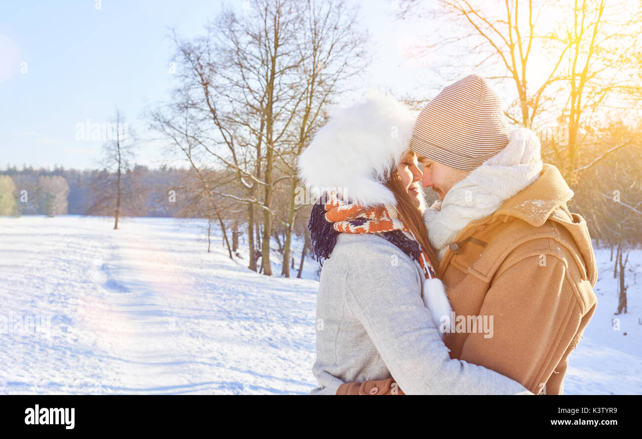 Couple In Love Embrace In Winter In The Snow Kissing Stock Photo Alamy Couple In Love Embrace In Winter In The Snow Kissing Stock Photo Alamy