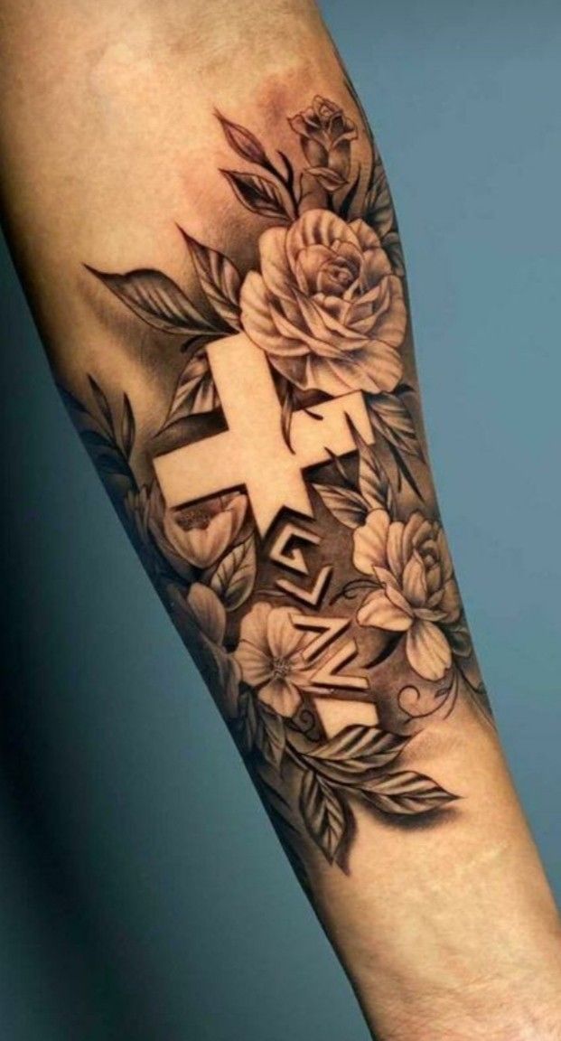 Cross Tattoo With Flowers: Meaning & Design Ideas  
Beautiful Cross & Floral Tattoo Combinations to Inspire  
Symbolic Cross and Flower Tattoos: A Stylish Fusion  
Elegant Cross Tattoos Enhanced With Floral Details  
Cross and Flower Tattoos: Timeless and Meaningful Designs