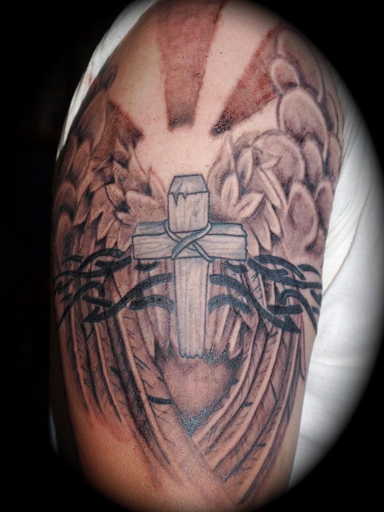 Cross With Sun Rays Tattoo: Meaning & Design Ideas