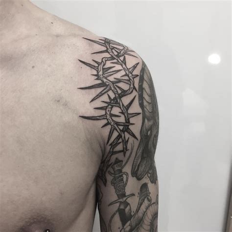 Crown Of Thorns Tattoo On The Left Shoulder Thorn Tattoo Tattoos Cage Tattoos