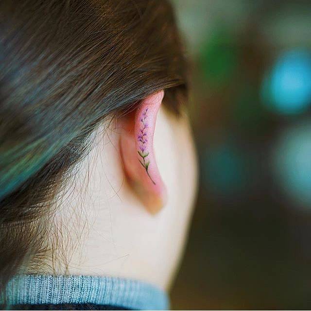 Ear Flower Tattoos: Delicate Beauty Trends 
Tiny Ear Tattoos: Floral Designs You'll Love 
Ear Tattoo Ideas: Pretty Flower Concepts 
Floral Ear Tattoos: Unique and Feminine 
Small Flower Tattoos Behind the Ear