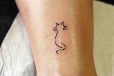 Minimalist Cat Tattoo Ideas: Line Art Simplicity