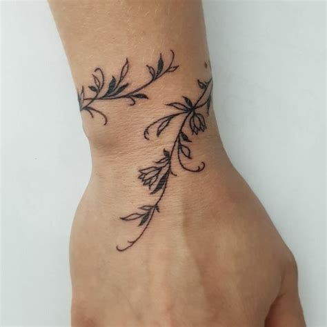 Pin By Aurore P On Tatoo Wrap Around Wrist Tattoos Flower Wrist