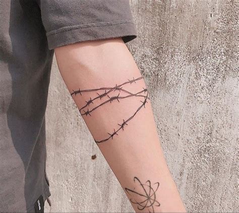 Pin By Willie Olsen On Boredpanda Barbed Wire Tattoos Wrap Around