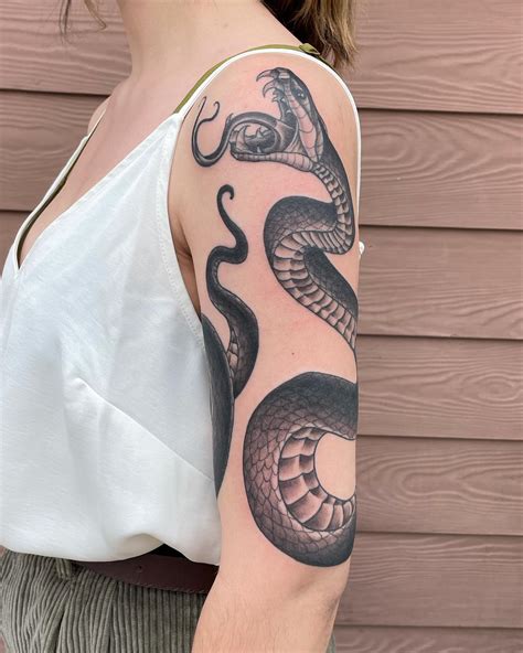Snake Tattoos Wrapped Around Arm: Bold Designs & Meanings