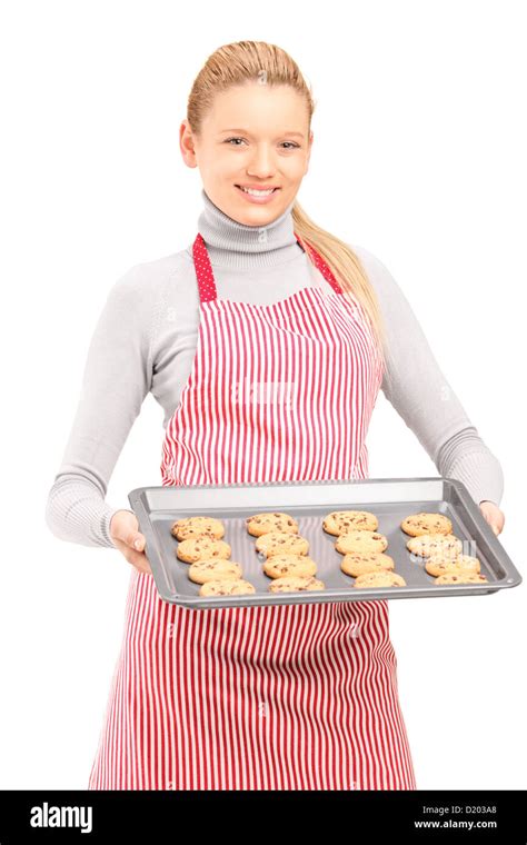 Young Woman Wearing Apron And Holding A Baking Tray With Cookies Stock